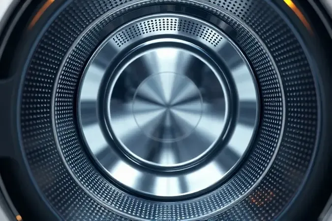 Detalhe em 3D do tambor de aço inox resistente de uma lavadora, destacando durabilidade e acabamento premium.